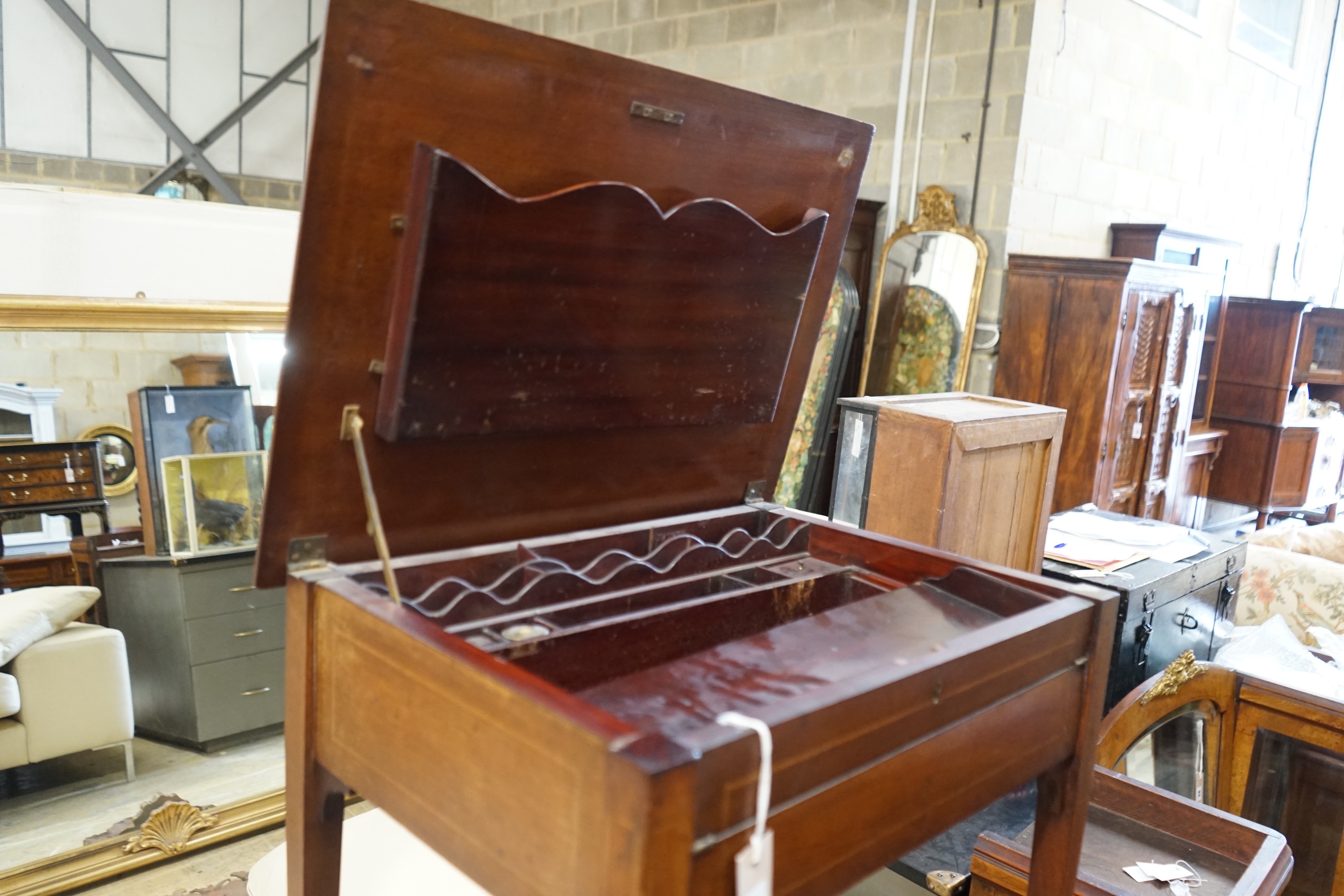 An Edwardian rectangular mahogany hinged top writing table, width 62cm, depth 45cm, height 74cm